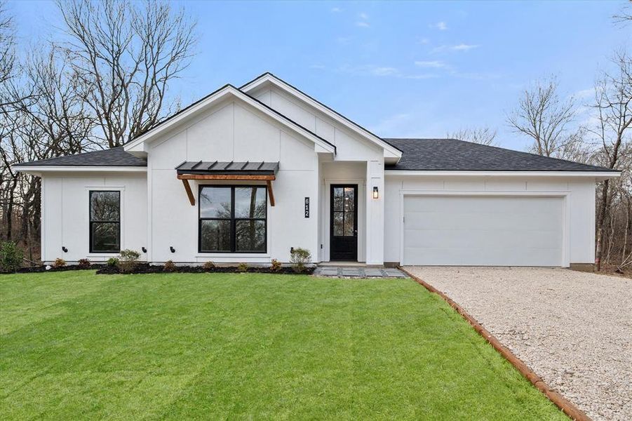 Front exterior of a new home in , Corsicana, TX, highlighting curb appeal (Image 23).