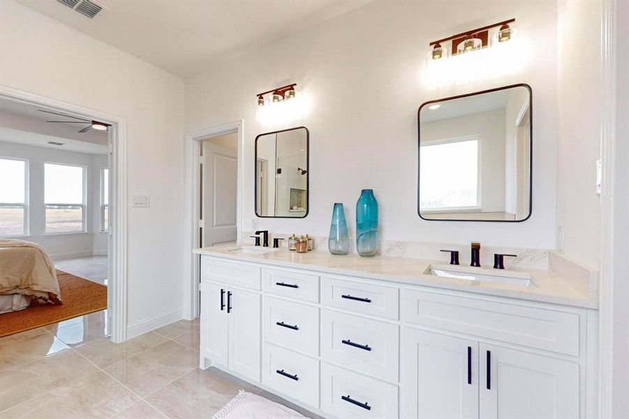 Bathroom with ceiling fan and vanity