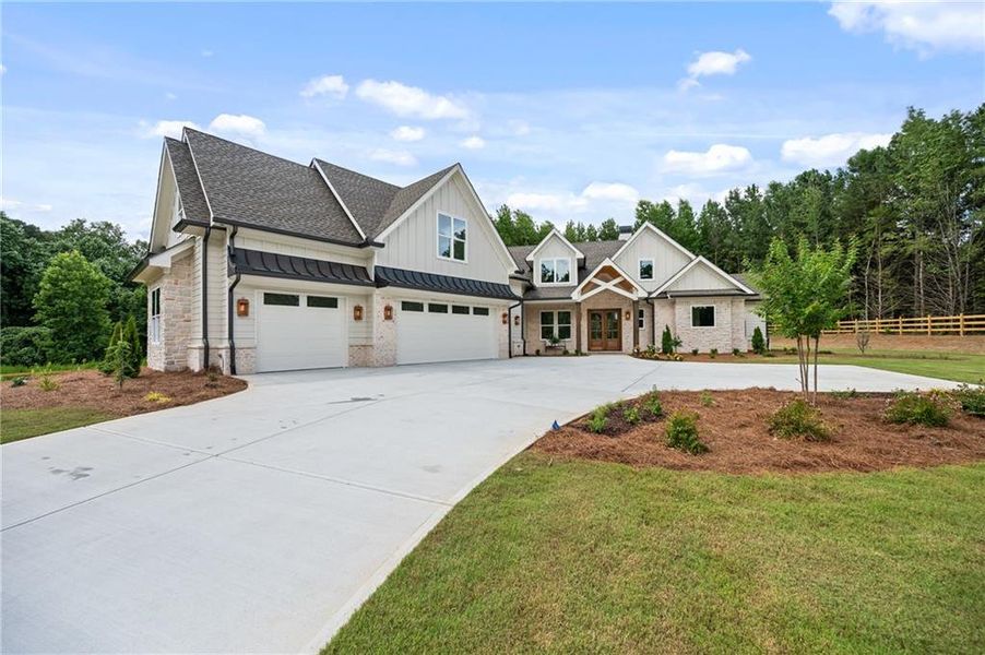 Front exterior of a new home in , Loganville, GA, highlighting curb appeal (Image 32). Front exterior of a new home in , Loganville, GA, highlighting curb appeal (Image 32).