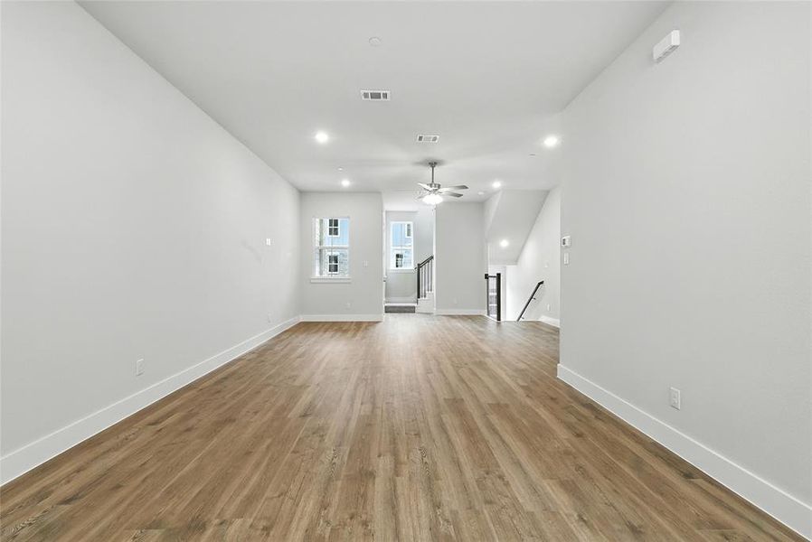Unfurnished living room featuring recessed lighting, light wood finished floors, and ceiling fan