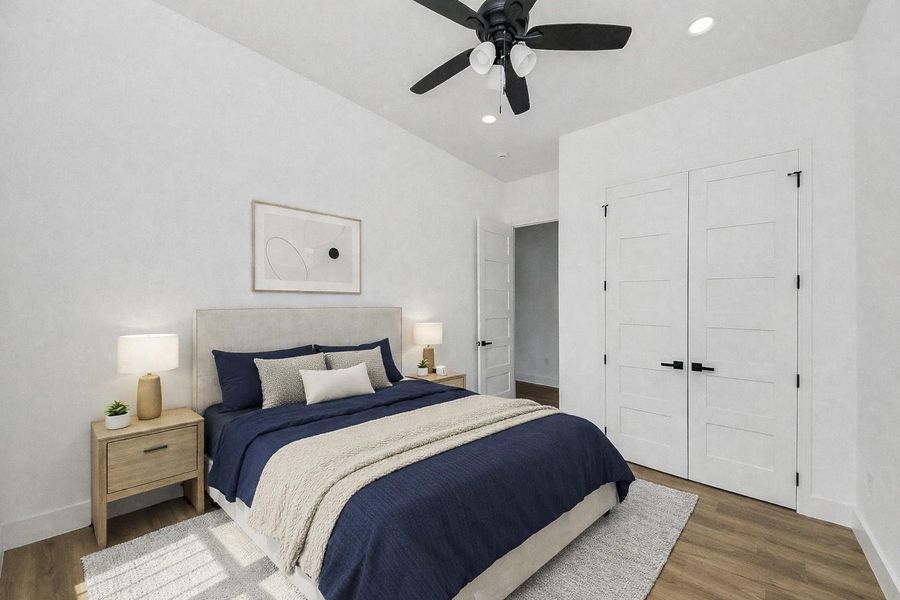 Bright guest bedroom with abundant natural light and a clean, modern feel.