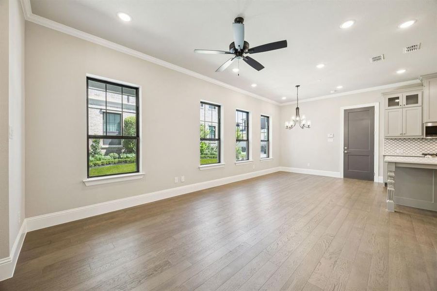 Large living room with view of dining area. Large living room with view of dining area.