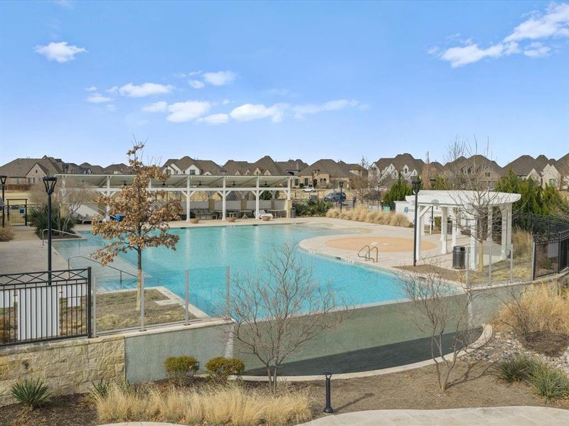Community pool with a residential view, a patio, and a pergola