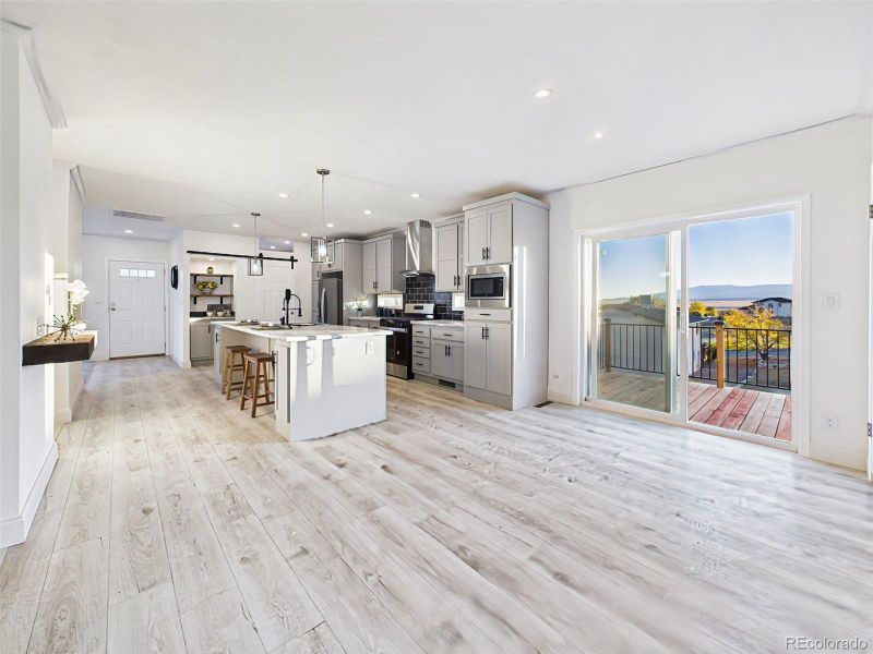 Bright and open dining area with sliding glass doors leading to outdoor living space. Bright and open dining area with sliding glass doors leading to outdoor living space.