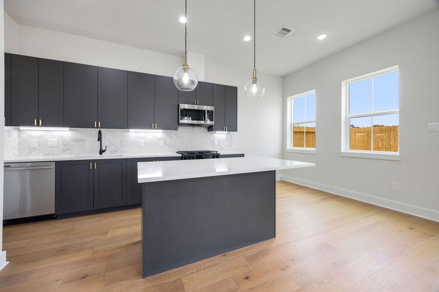 Spacious kitchen with abundant natural light Spacious kitchen with abundant natural light