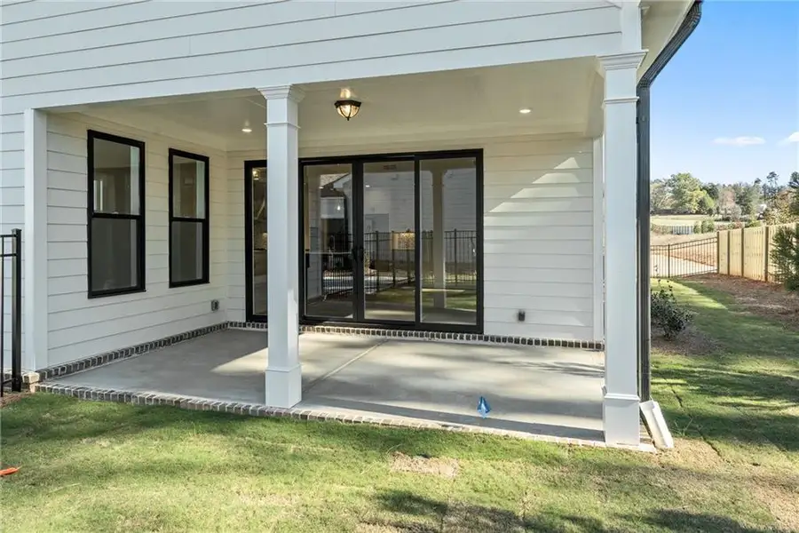 Exterior details and patio area of a home in Promenade at Sawnee Village, Cumming (Image 3). Exterior details and patio area of a home in Promenade at Sawnee Village, Cumming (Image 3).