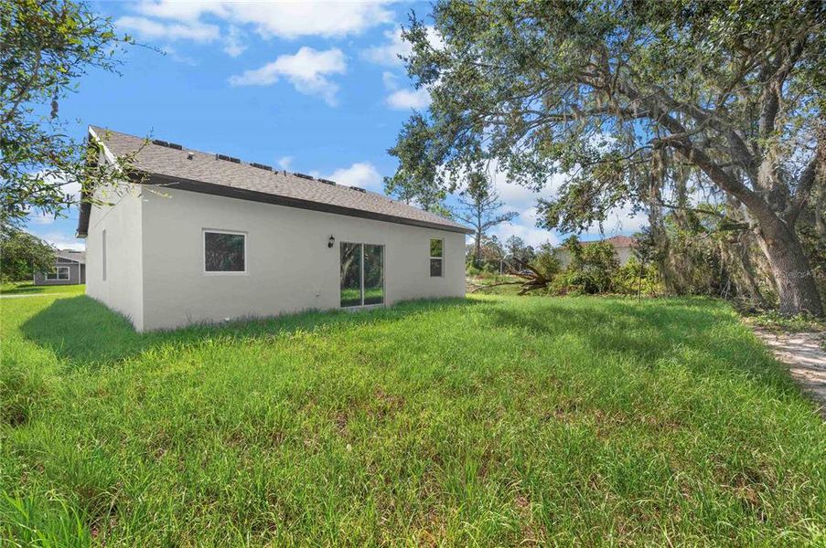 Front exterior of a new home in Poinciana, Poinciana, FL, highlighting curb appeal (Image 12).