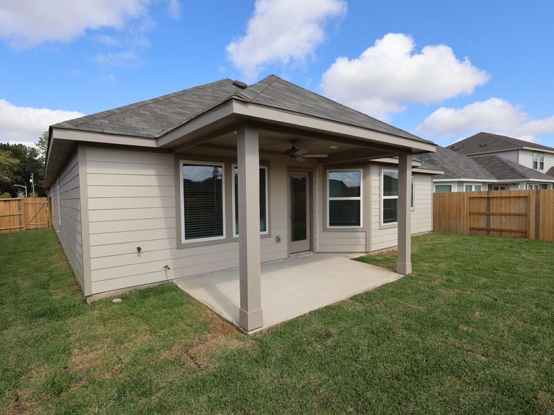 Exterior details and patio area of a home in Pinewood at Grand Texas, New Caney (Image 4). Exterior details and patio area of a home in Pinewood at Grand Texas, New Caney (Image 4).