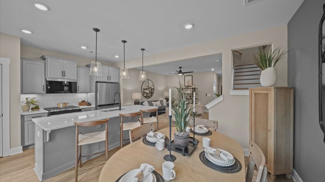 Exceptional kitchen featuring a spacious island, eye-catching pendant lights, and modern finishes