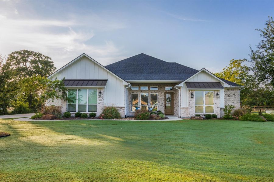 Front exterior of a new home in , College Station, TX, highlighting curb appeal (Image 22).