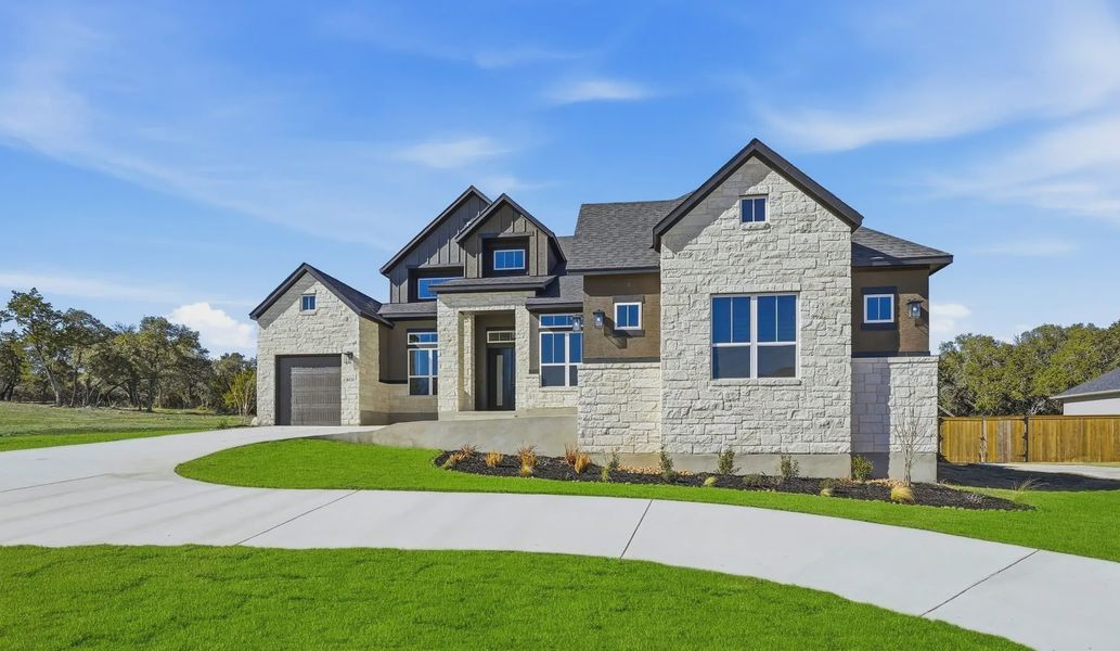 Front exterior of a new home in Heimer Estates at Garden Ridge, San Antonio, TX, highlighting curb appeal (Image 13).