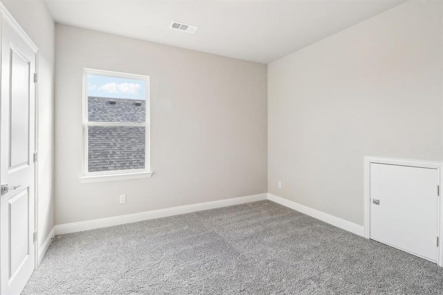 Unfurnished room featuring carpet flooring