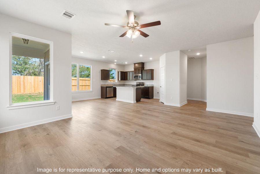 Unfurnished living room with a ceiling fan, recessed lighting, and light wood-style flooring