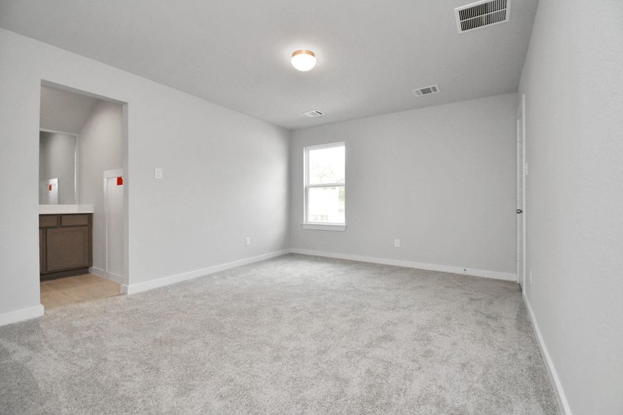 Secondary bedroom features plush carpeting, large windows that let in plenty of natural light, bright paint, and spacious closets. Secondary bedroom features plush carpeting, large windows that let in plenty of natural light, bright paint, and spacious closets.