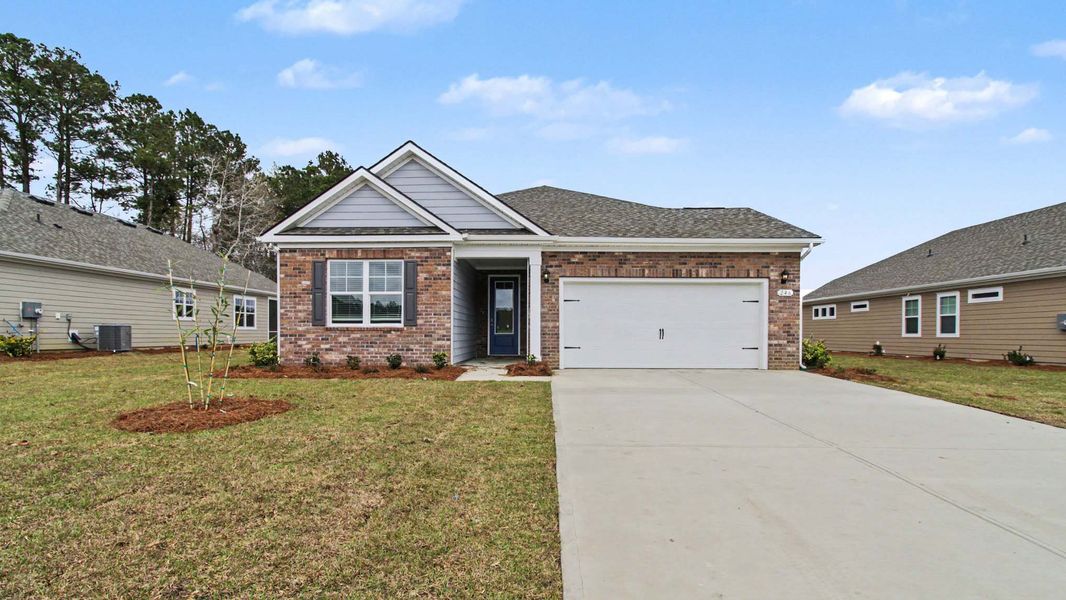 Front exterior of a new home in The Bluffs at Mill Creek, Florence, SC, highlighting curb appeal (Image 2). Front exterior of a new home in The Bluffs at Mill Creek, Florence, SC, highlighting curb appeal (Image 2).