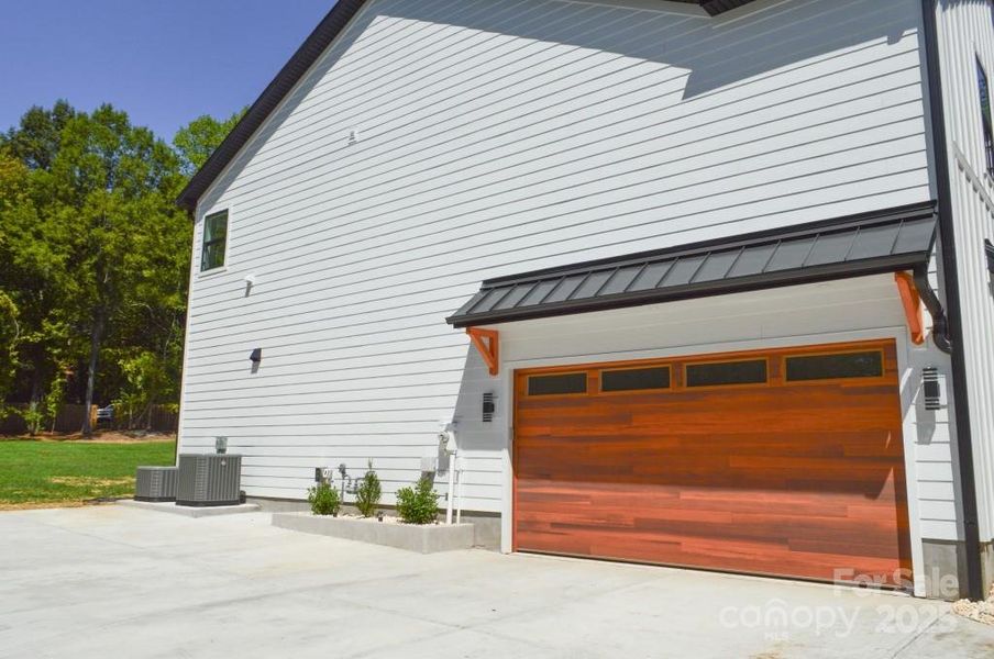 Front exterior of a new home in , Davidson, NC, highlighting curb appeal (Image 1).