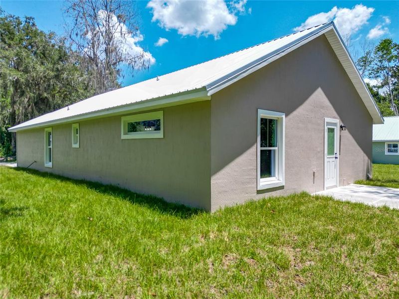 Front exterior of a new home in , Lake Panasoffkee, FL, highlighting curb appeal (Image 1).