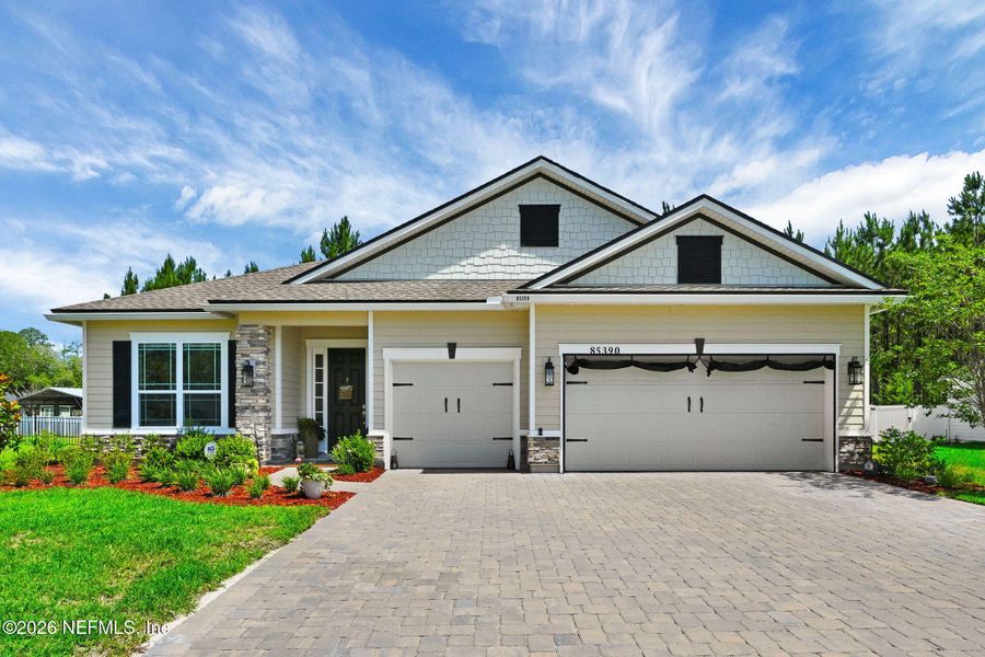 Front exterior of a new home in , Yulee, FL, highlighting curb appeal (Image 25).