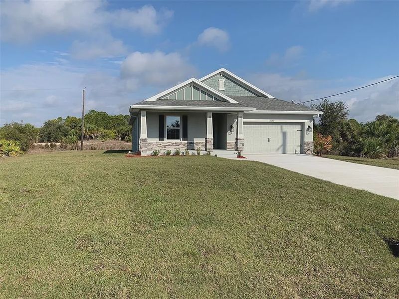 Front exterior of a new home in Gulf Cove, Port Charlotte, FL, highlighting curb appeal (Image 7). Front exterior of a new home in Gulf Cove, Port Charlotte, FL, highlighting curb appeal (Image 7).
