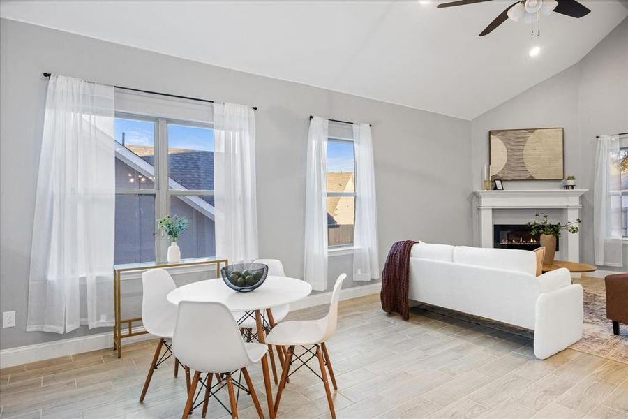 Dining room featuring ceiling fan and lofted ceiling