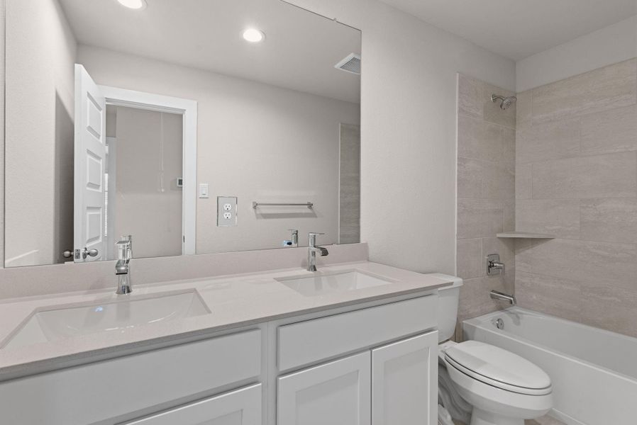 Furnished interior view inside a new home in Barton Creek Ranch, Conroe (Image 11).