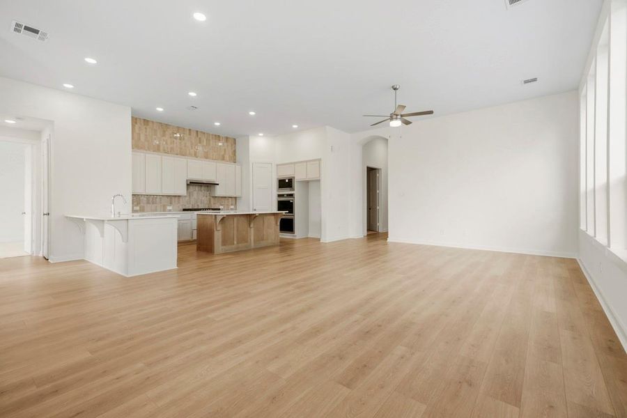 Light and airy family room with 11' tall ceilings and lots of windows Light and airy family room with 11' tall ceilings and lots of windows