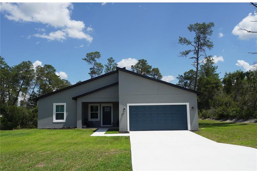 Front exterior of a new home in , Ocala, FL, highlighting curb appeal (Image 29).