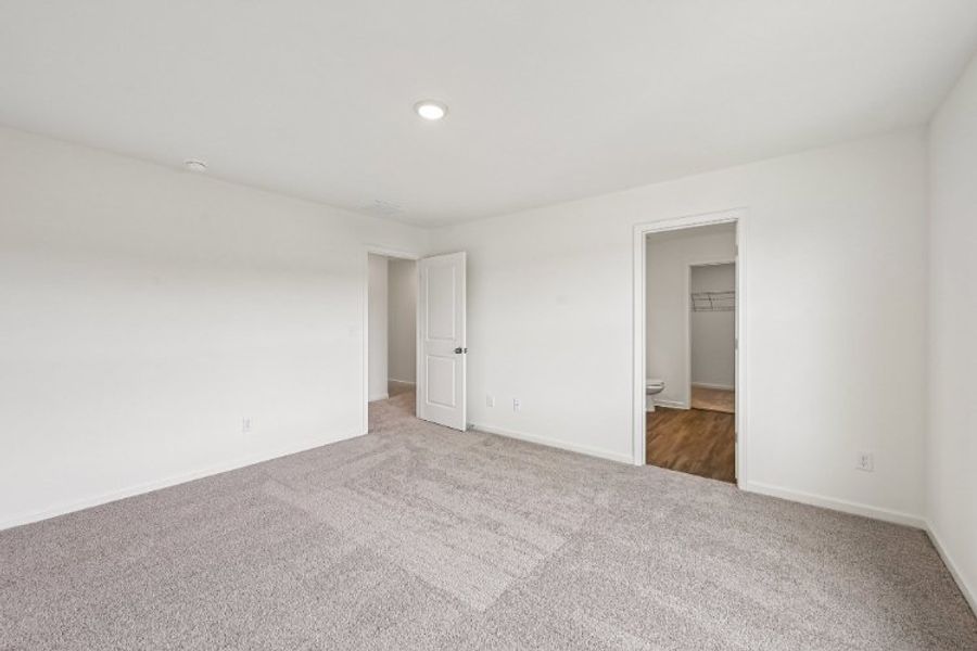 A hallway with white walls. A hallway with white walls.
