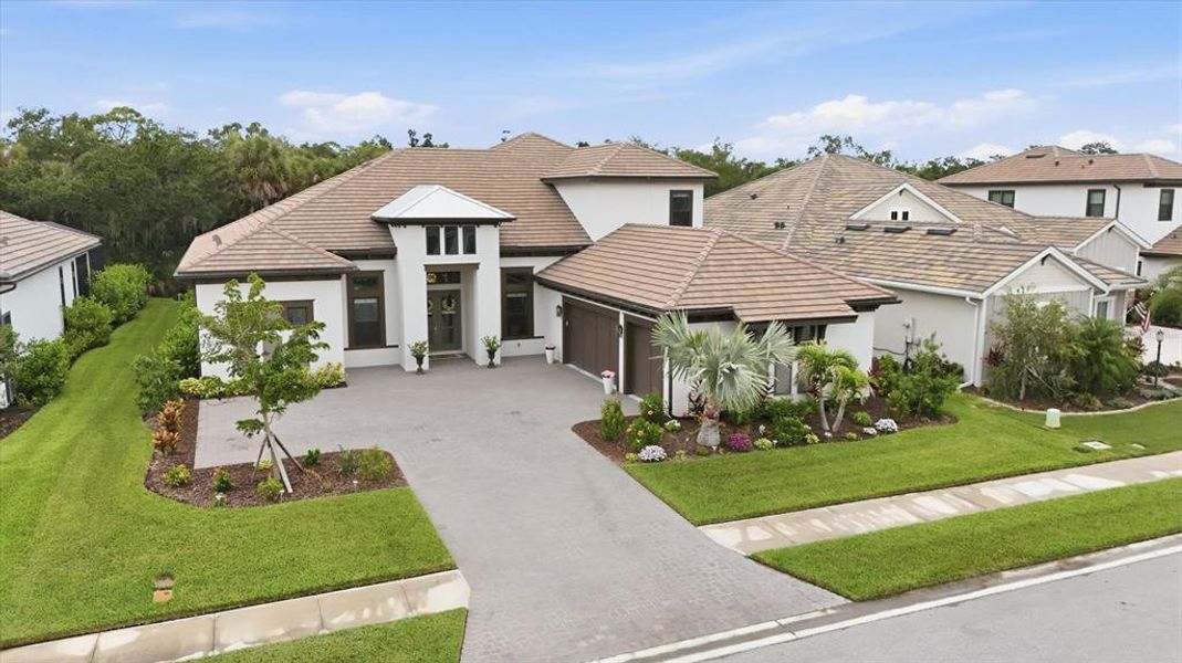 Front exterior of a new home in , Sarasota, FL, highlighting curb appeal (Image 2).
