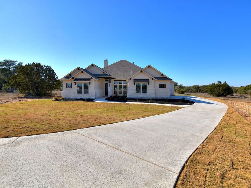 Representative exterior photo of a completed home built from the Siena II by Giddens Homes in Clearwater Ranch, Liberty Hill, TX (Image 41).
