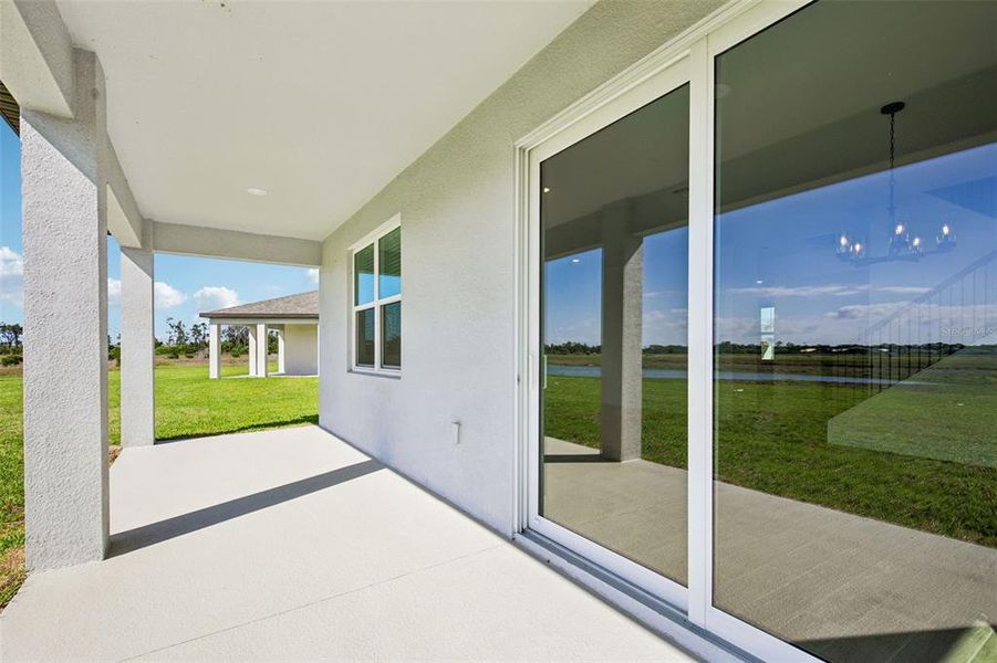 Exterior details and patio area of a home in Magnolia Bay - Reserve Series, Nokomis (Image 2). Exterior details and patio area of a home in Magnolia Bay - Reserve Series, Nokomis (Image 2).