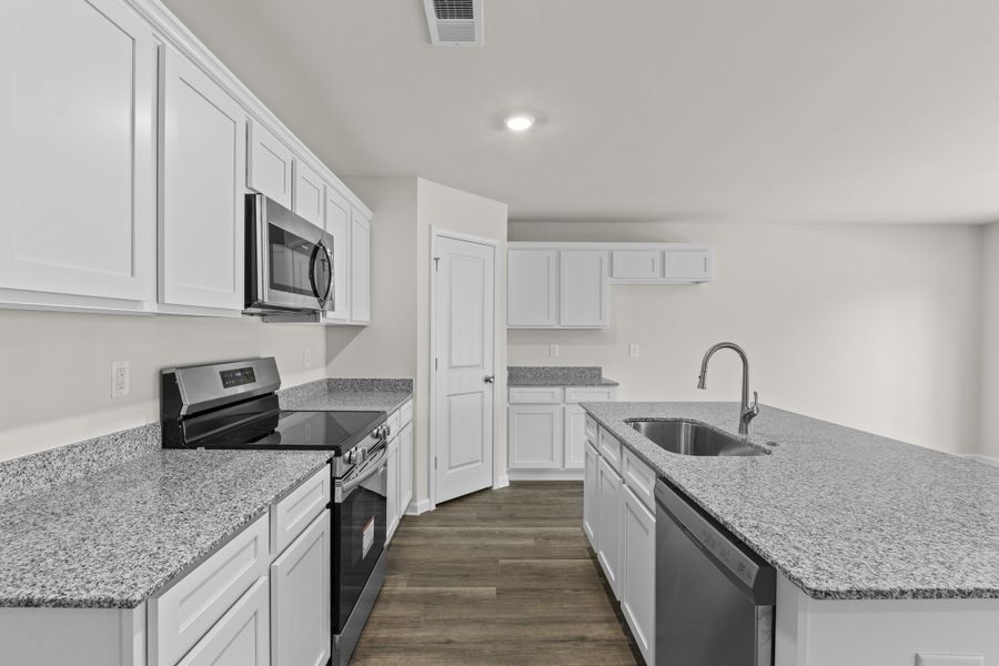 Representative furnished interior of a home built from the Cedar A by McGuinn Homes in Forts Ridge, Pelion (Image 5).