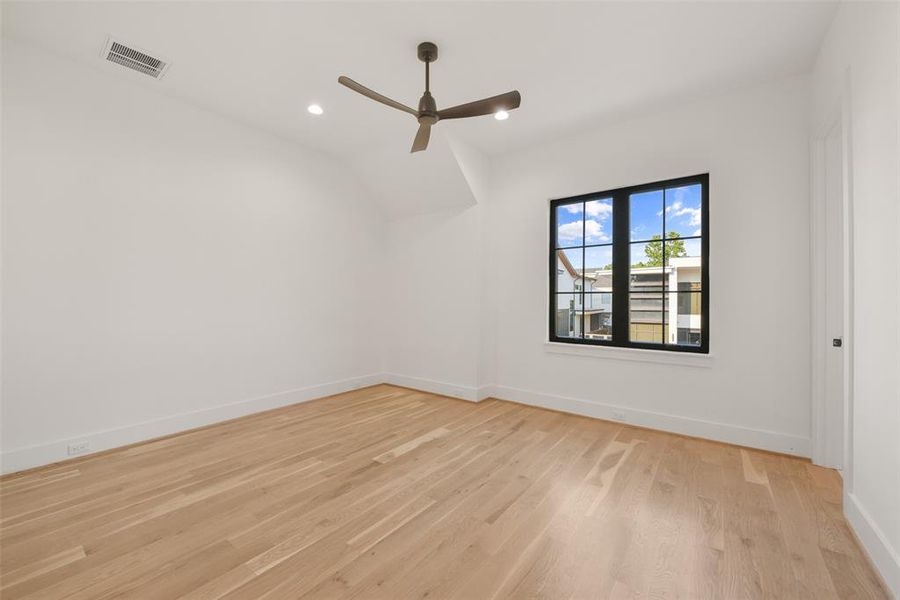 Bedroom two highlights the hardwood floors throughout.