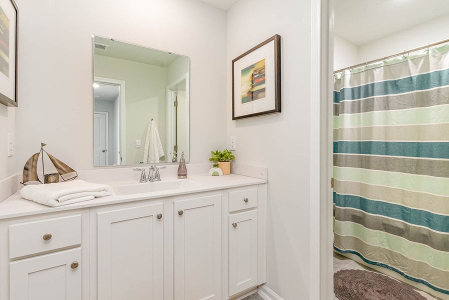 Representative furnished interior of a home built from the WREN by D.R. Horton in Kingston Bay, Conway (Image 23).