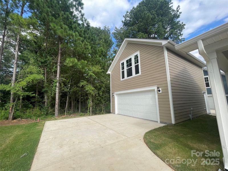 Rear, detached 2 car garage with finished bonus above that includes 1/2 bath and walk in storage Rear, detached 2 car garage with finished bonus above that includes 1/2 bath and walk in storage