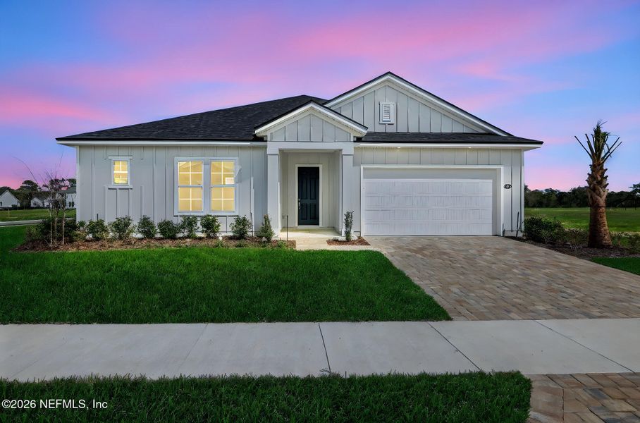Front exterior of a new home in Veranda Bay, Flagler Beach, FL, highlighting curb appeal (Image 22).