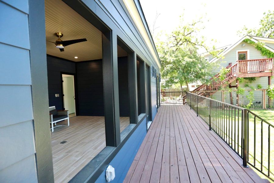 Wooden deck featuring a ceiling fan