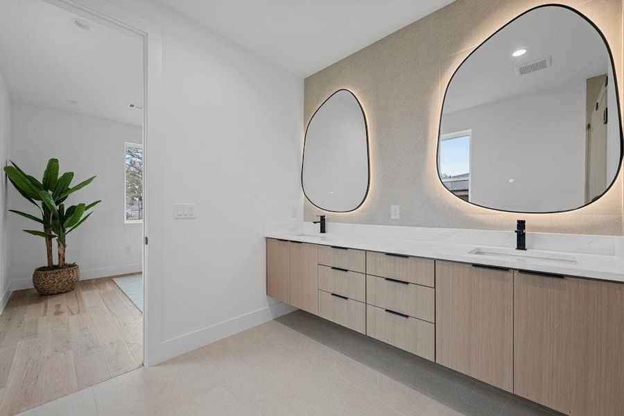 Full bathroom featuring double vanity and recessed lighting
