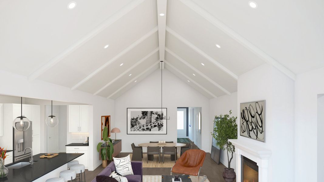 Vaulted ceiling with white-painted ceiling beams and fireplace Vaulted ceiling with white-painted ceiling beams and fireplace