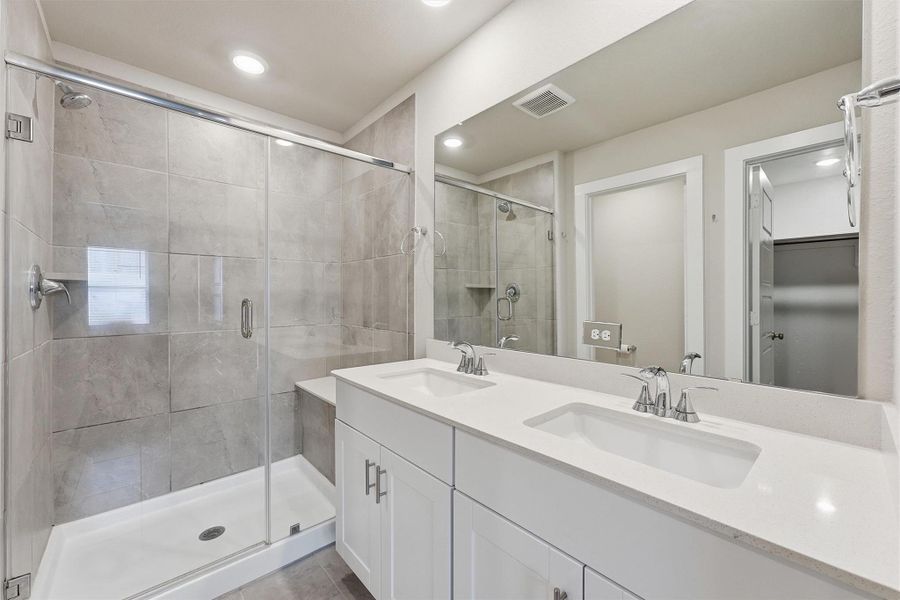 Primary Bath has a large shower and double sink vanity. Primary Bath has a large shower and double sink vanity.