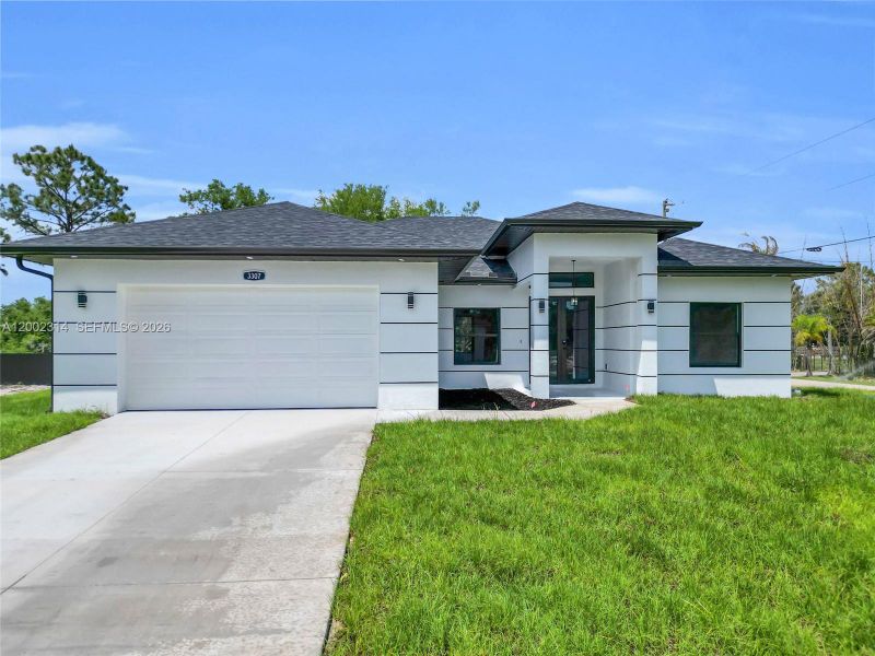 Front exterior of a new home in , Lehigh Acres, FL, highlighting curb appeal (Image 16).