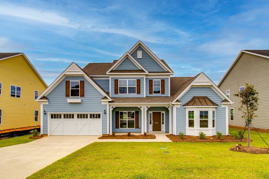 Front exterior of a new home in Palmetto Shores, Chapin, SC, highlighting curb appeal (Image 1).