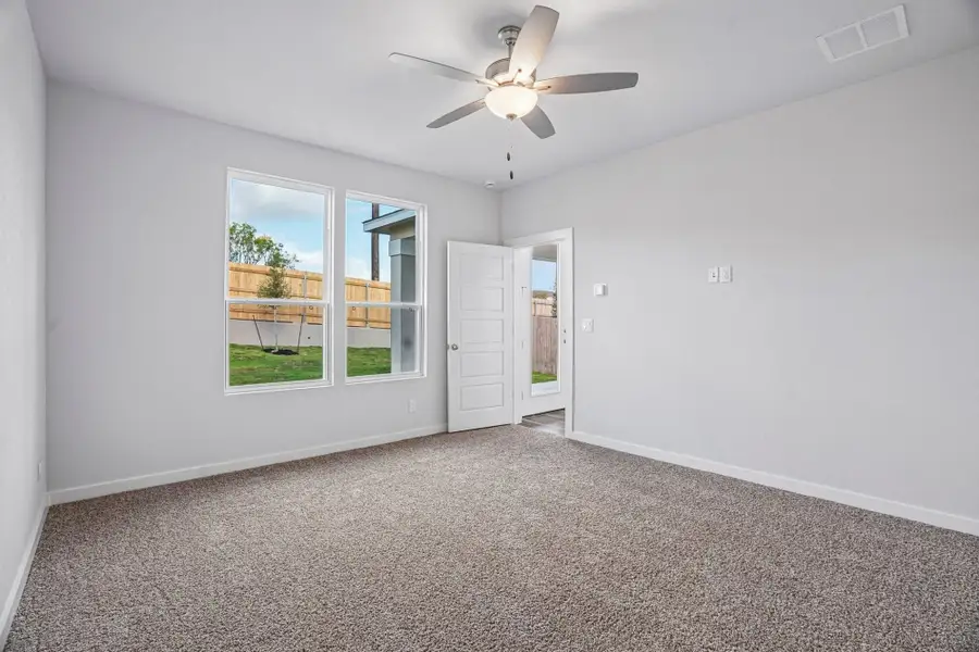Spacious, unfurnished interior of a new home in The Meadows at Hunters Ranch, San Antonio (Image 23).
