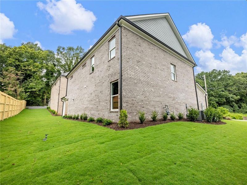 Front exterior of a new home in , Buford, GA, highlighting curb appeal (Image 22). Front exterior of a new home in , Buford, GA, highlighting curb appeal (Image 22).
