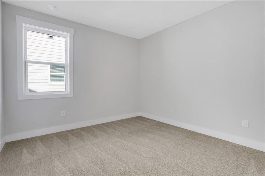 Spacious, unfurnished interior of a new home in The Paddocks at Doc Hughes, Buford (Image 27).