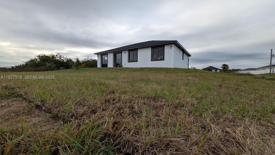 Exterior details and patio area of a home in , Labelle (Image 24).