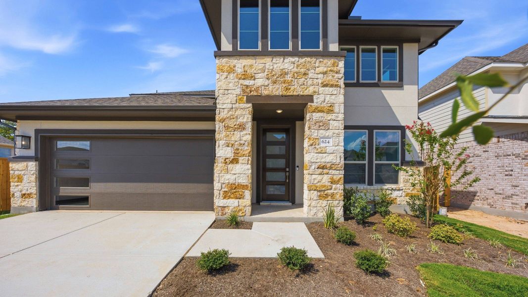Front exterior of a new home in Oaks at San Gabriel, Georgetown, TX, highlighting curb appeal (Image 23).