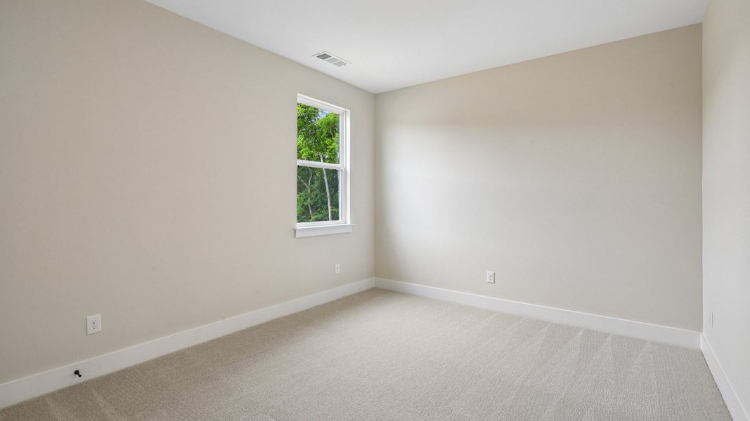 Bedroom with carpet and window Bedroom with carpet and window