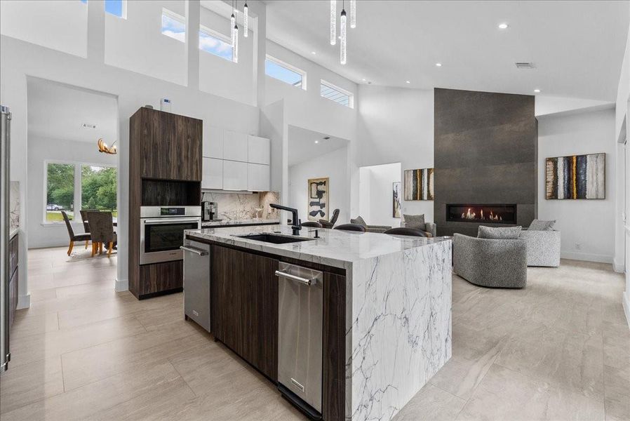 A massive waterfall island is the highlight of this kitchen. Imported Italian granite adorns this flowing kitchen island.