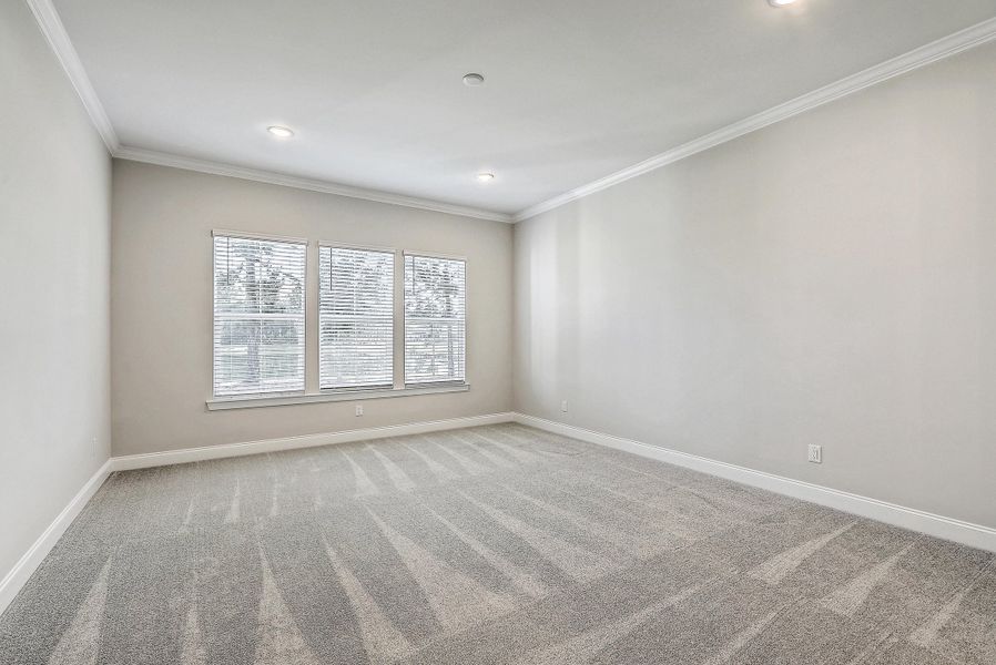 Spacious, unfurnished interior of a new home in K. Hovnanian's® Four Seasons at Lakes of Cane Bay, Summerville (Image 31).